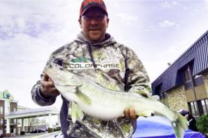 Walleye pro Dave Schmidt holding walleye