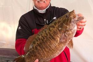 Scott Bonnema holds 8 pound Smallmouth by Scott Bonnema holds 8 pound Smallmouth...