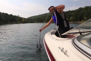 Boater raising up a boat anchor
