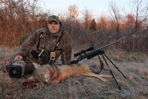 Predator hunter with his harvested coyote