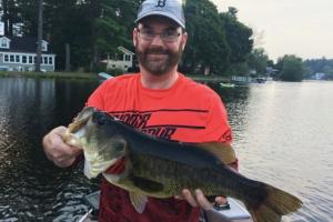 Trophy bass being held proudly by the angler 