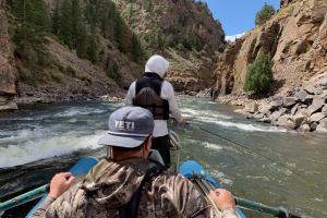 Boater oaring the Colorado river rapids