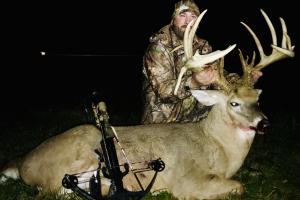A deer hunter with trophy buck to remember