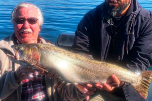 Angler holding a 13.4 lb Cutthroat Trout he caught in Pyramid Lake