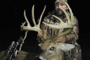 Deer hunter and large buck he shot  with a bow