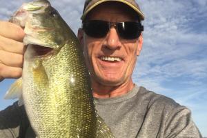 Angler Bruce Scheub holding up his Big Bass