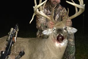Straight on view of hunter with trophy buck