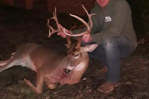 Deer hunter with a Tennessee whitetail buck