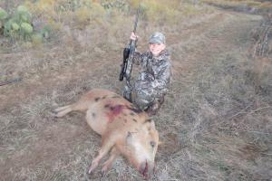 Young boy is a proud Hog Hunter