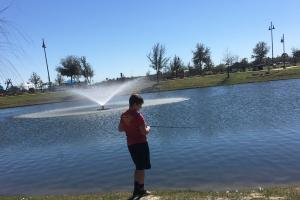Boy fishing in a pond