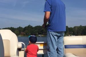 Young toddler looking at the water