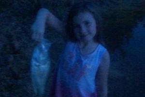Young girl holding a 2 lb crappie