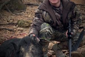 Wild pig hunter with wild pig he shot