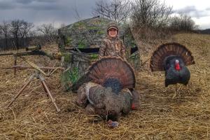 Proud young turkey hunter with his harvest