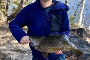 Young angler with large black crappie