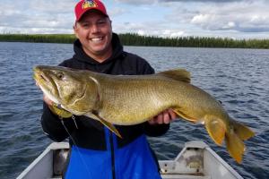 Wes David holding a large walleye fish