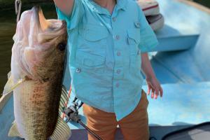 Young angler holding a nice bass