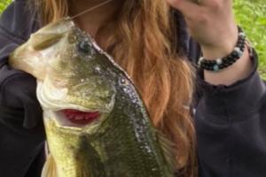 Lady angler holding a bass