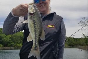 Lady angler fishing bass with Lew's gear