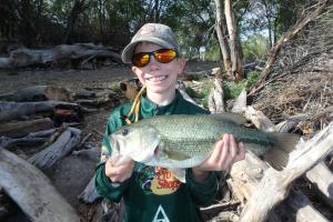 Young angler with a largemouth bass