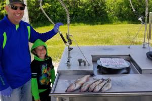 Father son with a large catch of fish