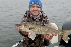 Young angler with walleye