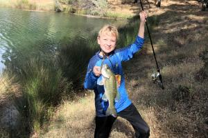 Young angler catchin' Bass