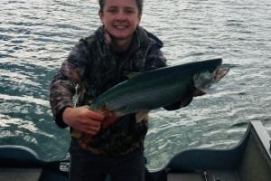 Young Angler with Cutbow Trout