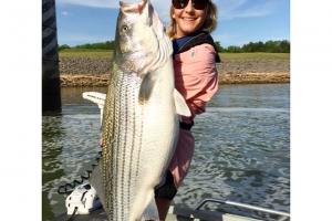 Lady angler with big Striper Bass