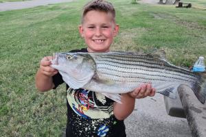 Young angler & striped bass