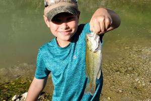 Boy with his bass catch