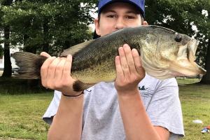 Angler holding a 5 lb Bass