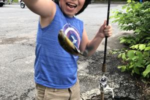 Excited boy with his fish