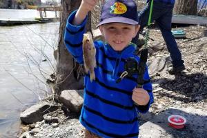 young boy hooked a bluegill