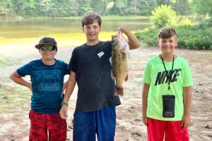 3 boys one with a bass