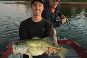 Angler holding large bass