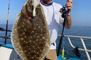 angler holding flounder