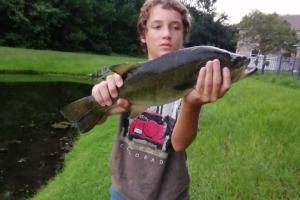 Boy with Pond Bass
