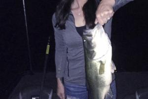 lady angler holding bass