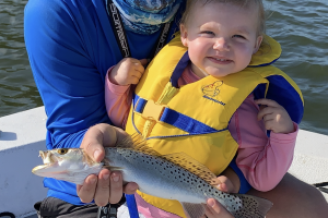 small boy, dad, sea trout