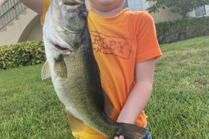 boy holding bass