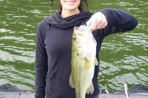 lady angler holding bass