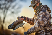 Hunter wearing layered clothing while hunting for waterfowl